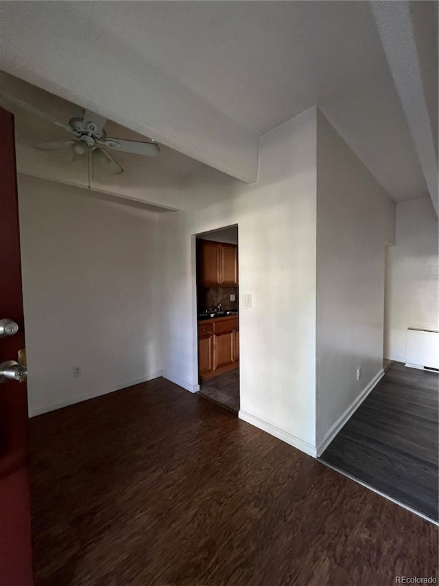 364 S Ironton St Unit 217, Aurora, CO 80012 - empty room featuring a ceiling fan, dark wood-style floors, and radiator
