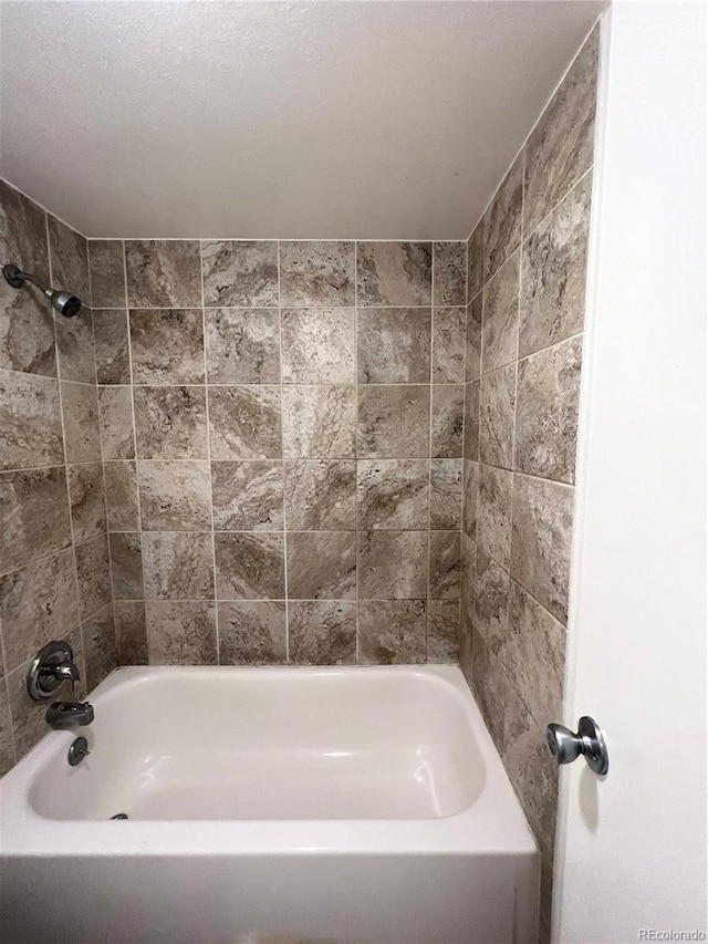364 S Ironton St Unit 217, Aurora, CO 80012 - full bathroom featuring bathing tub / shower combination