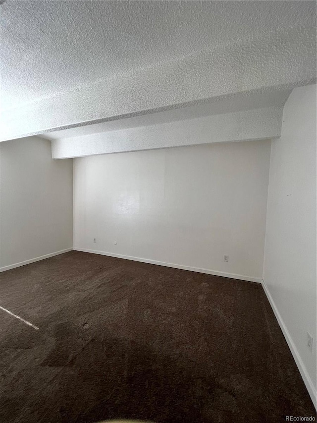 364 S Ironton St Unit 217, Aurora, CO 80012 - finished basement featuring a textured ceiling and dark colored carpet