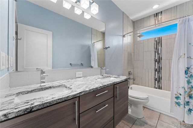 full bathroom featuring tile patterned flooring, shower / bath combination with curtain, toilet, and vanity