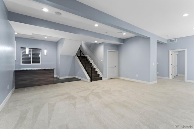 basement featuring light carpet