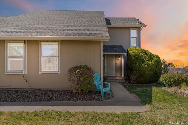 2645 S Xanadu Way Unit D, Aurora, CO 80014 - view of front facade with a shingled roof and a lawn