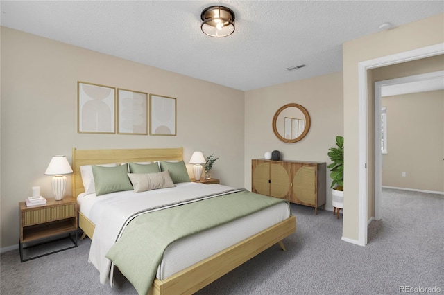 15650 E Eldorado Dr, Aurora, CO 80013 - carpeted bedroom featuring baseboards and a textured ceiling