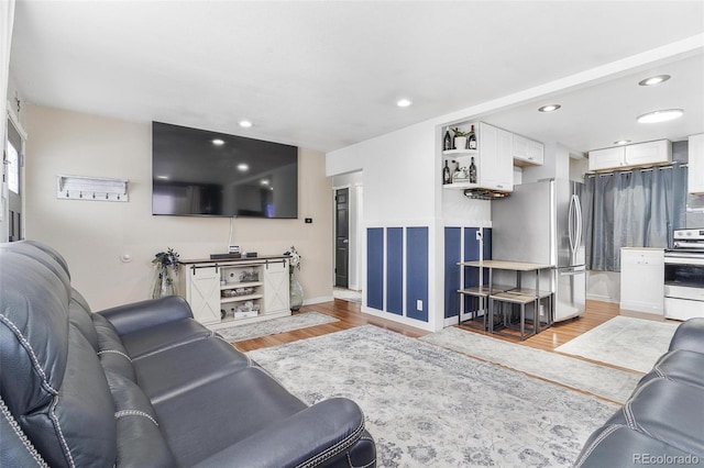 living room with light hardwood / wood-style floors