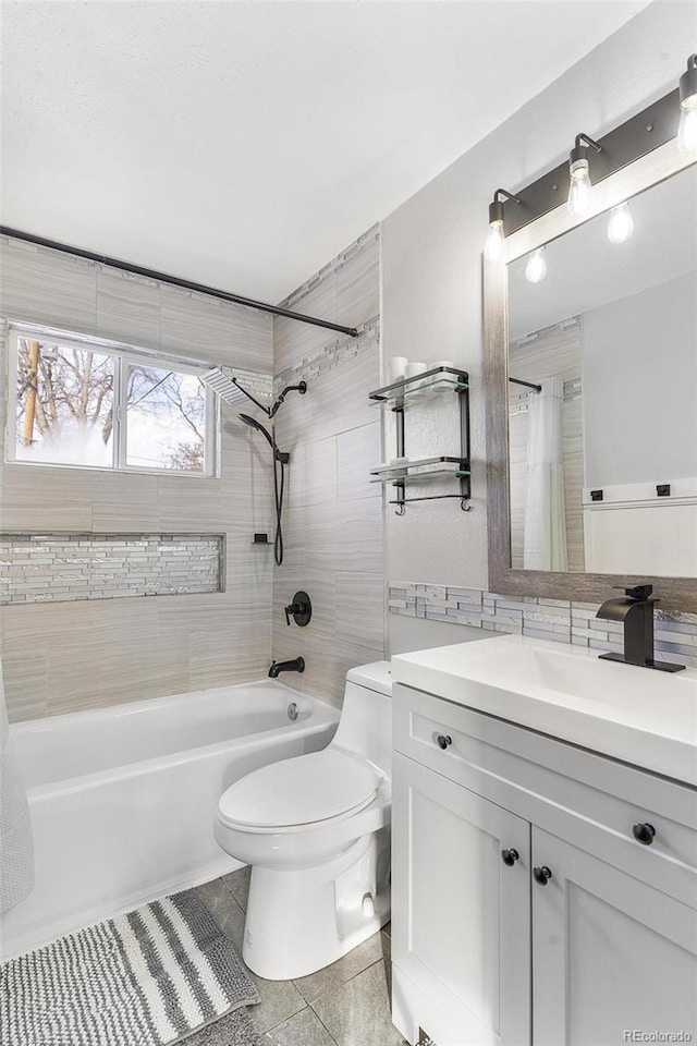 full bathroom with tile patterned floors, vanity, toilet, and shower / bath combo