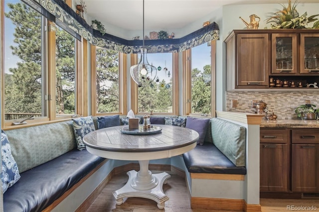 30206 Telluride Ln, Evergreen, CO 80439 - dining room with breakfast area, plenty of natural light, and wood finished floors