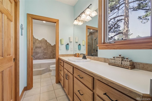30206 Telluride Ln, Evergreen, CO 80439 - bathroom with tile patterned floors, a tub to relax in, vanity, and a shower with door