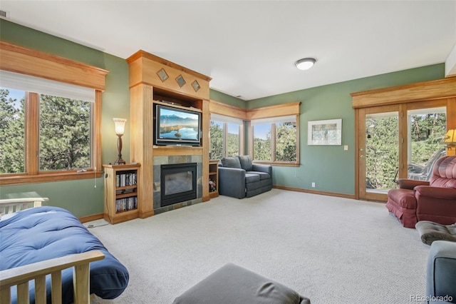 30206 Telluride Ln, Evergreen, CO 80439 - living area with a fireplace, carpet flooring, and plenty of natural light