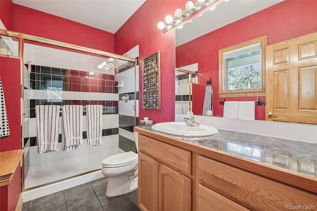 30206 Telluride Ln, Evergreen, CO 80439 - bathroom with vanity, a stall shower, and tile patterned flooring