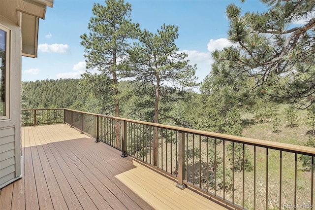 30206 Telluride Ln, Evergreen, CO 80439 - wooden deck featuring a wooded view