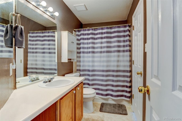 full bath featuring vanity, curtained shower, toilet, and tile patterned flooring