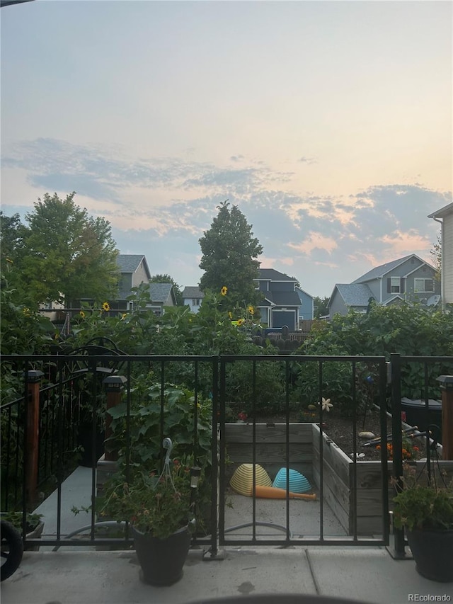 view of balcony at dusk