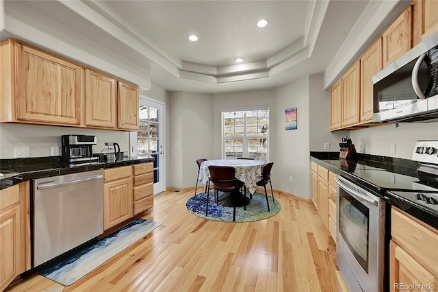 11770 Leavenworth Dr, Conifer, CO 80433 - kitchen featuring plenty of natural light, stainless steel appliances, light wood-style flooring, and light brown cabinetry