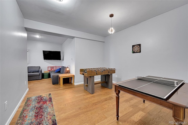 11770 Leavenworth Dr, Conifer, CO 80433 - rec room featuring baseboards and light wood-style floors