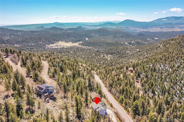 11770 Leavenworth Dr, Conifer, CO 80433 - drone / aerial view featuring a mountain view and a view of trees
