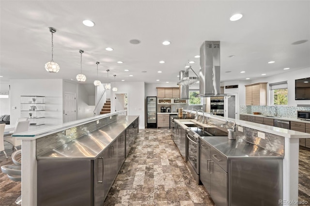 kitchen with pendant lighting, a large island, island exhaust hood, decorative backsplash, and stainless steel appliances