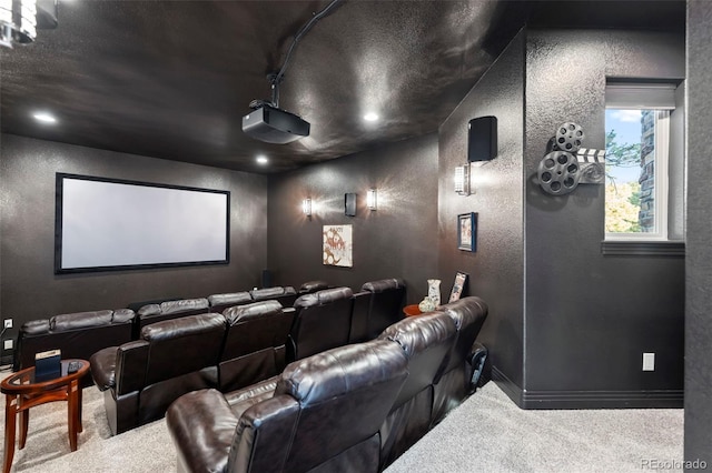 home theater featuring a textured ceiling and carpet floors