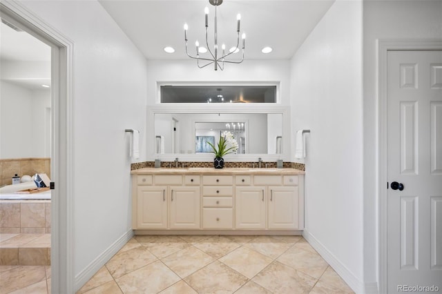 bathroom featuring a relaxing tiled tub, vanity, a chandelier, and tile patterned flooring