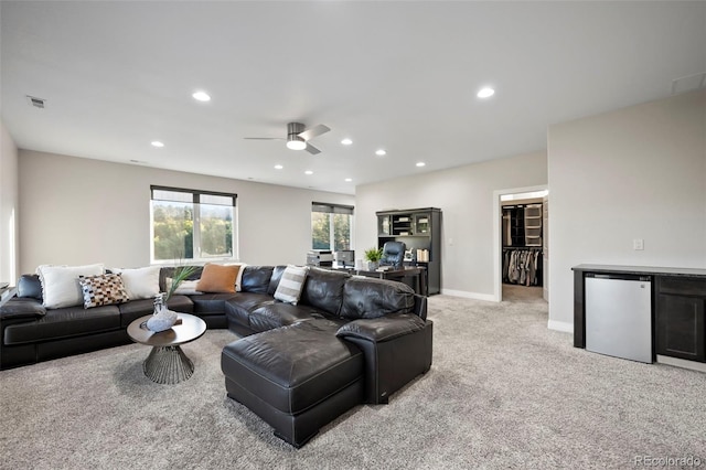 living room featuring ceiling fan and light carpet