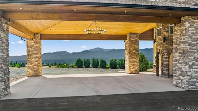 view of patio / terrace featuring a gazebo and a mountain view