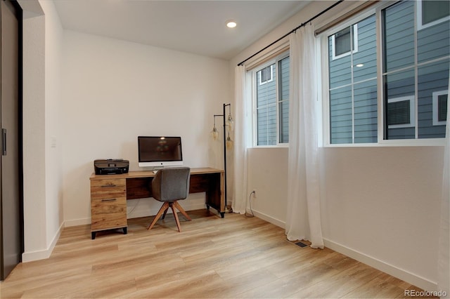 office area with light wood-type flooring