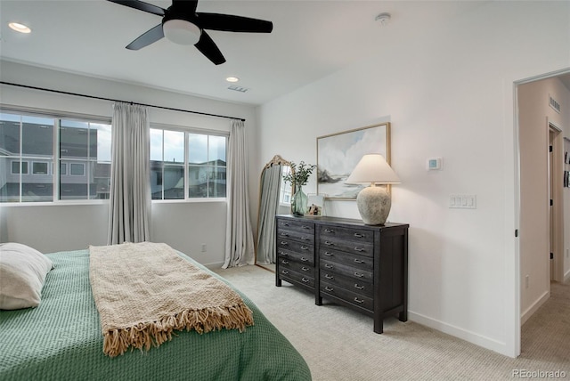 bedroom featuring ceiling fan and light colored carpet