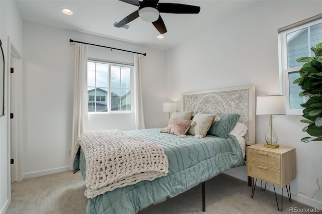 bedroom featuring light carpet and ceiling fan