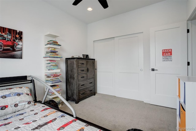 bedroom with ceiling fan and carpet floors