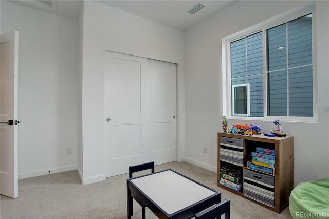 carpeted bedroom featuring a closet