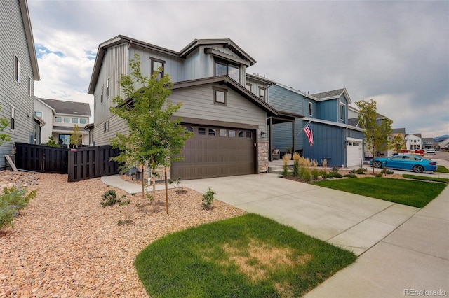 view of front facade featuring a garage and a front lawn