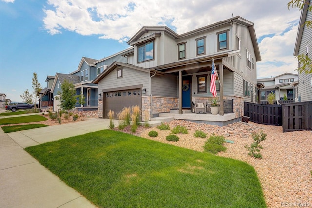 craftsman-style house with a garage, a porch, and a front yard