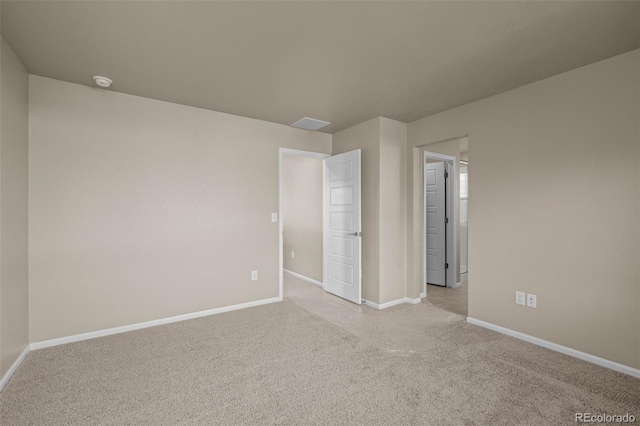 spare room with light colored carpet