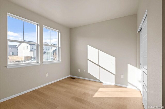 unfurnished room featuring light hardwood / wood-style flooring