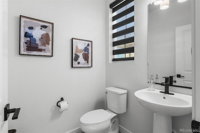 bathroom with sink and toilet