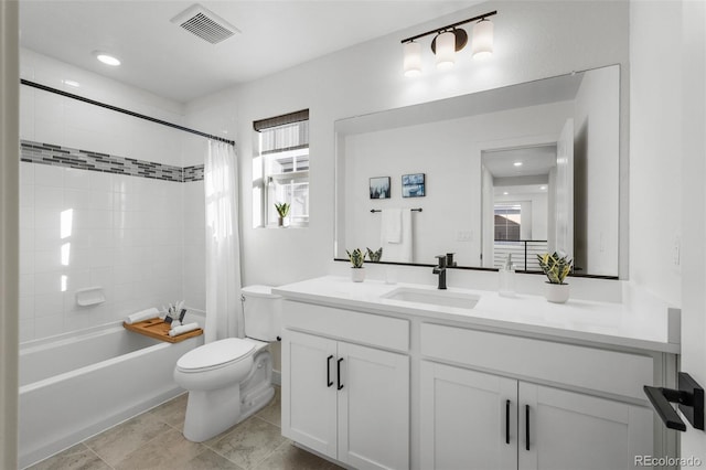 full bathroom with tile patterned floors, vanity, toilet, and shower / bath combo