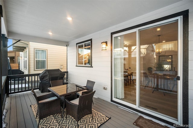 wooden deck with grilling area and a porch