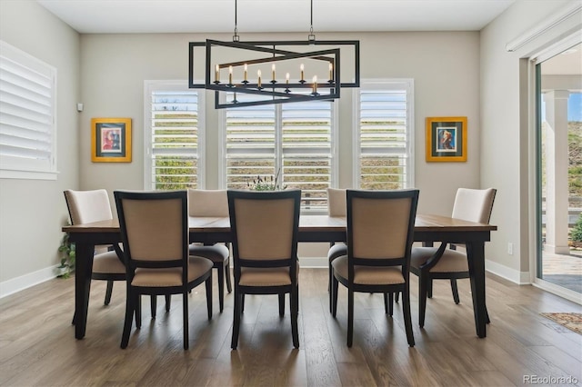 547 Scrubjay Cir, Castle Rock, CO 80104 - dining room featuring wood finished floors and a chandelier