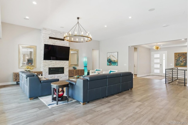 547 Scrubjay Cir, Castle Rock, CO 80104 - living area with a chandelier, light wood finished floors, a fireplace, and recessed lighting