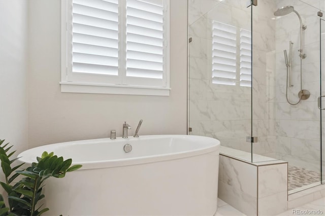 547 Scrubjay Cir, Castle Rock, CO 80104 - full bath featuring plenty of natural light, a freestanding tub, and a stall shower