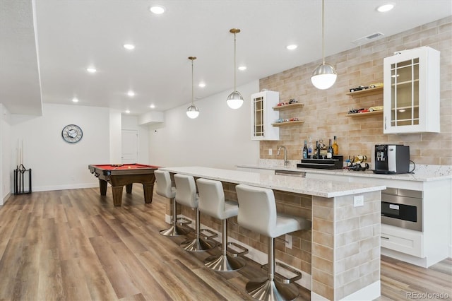 547 Scrubjay Cir, Castle Rock, CO 80104 - indoor wet bar featuring decorative backsplash, light wood-type flooring, recessed lighting, decorative light fixtures, and billiards table