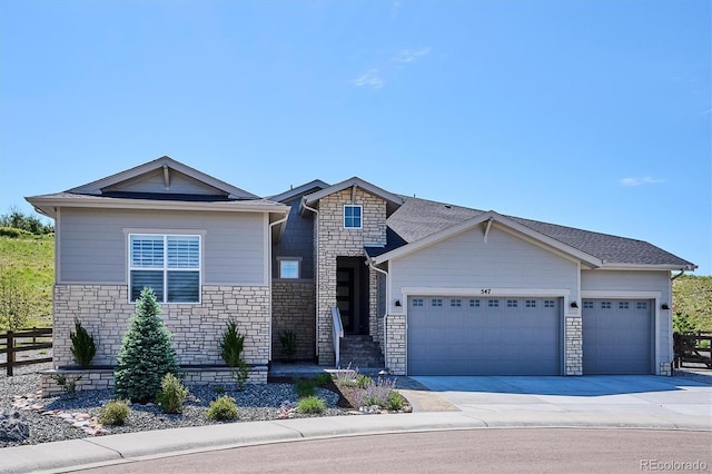 547 Scrubjay Cir, Castle Rock, CO 80104 - view of front of home with stone siding, a garage, and driveway