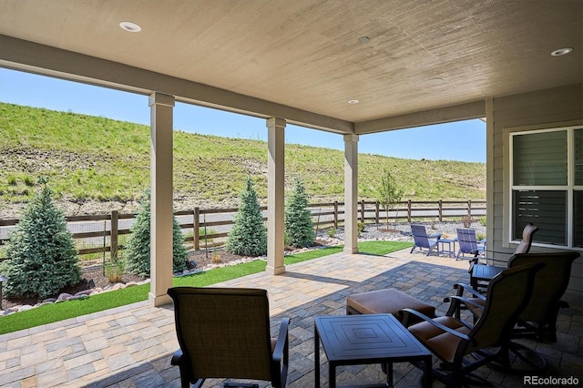 547 Scrubjay Cir, Castle Rock, CO 80104 - wooden deck featuring a fenced backyard and a patio area