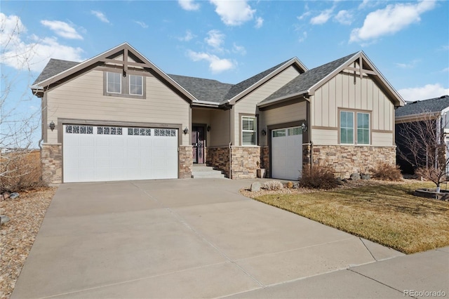 craftsman inspired home featuring stone siding, board and batten siding, concrete driveway, and roof with shingles