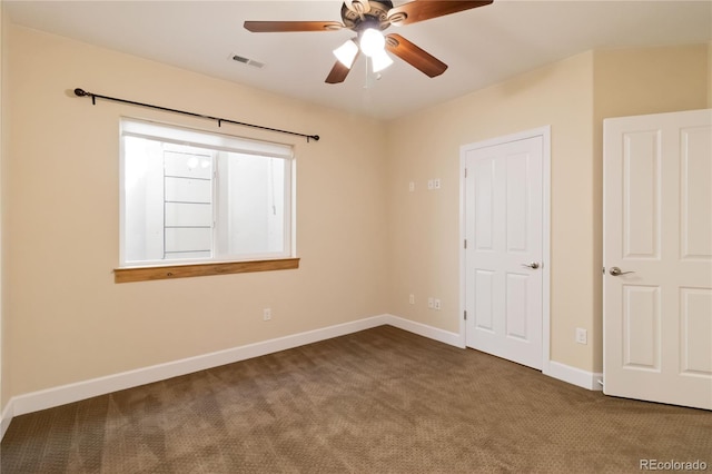 unfurnished bedroom with visible vents, baseboards, carpet, and ceiling fan