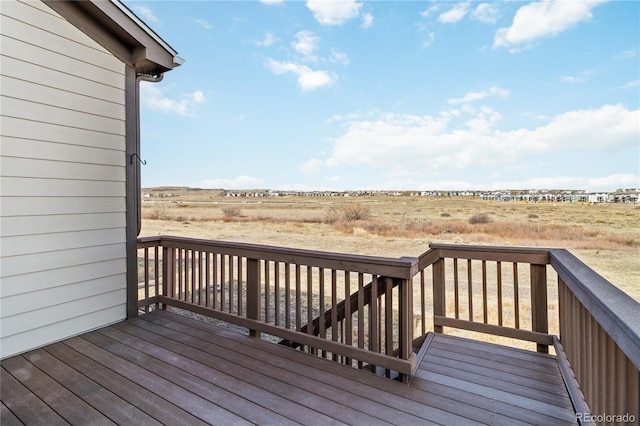 wooden terrace with a rural view