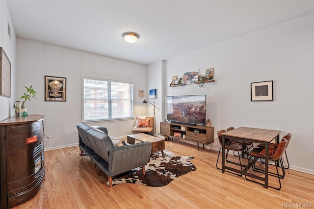 living room with light hardwood / wood-style flooring