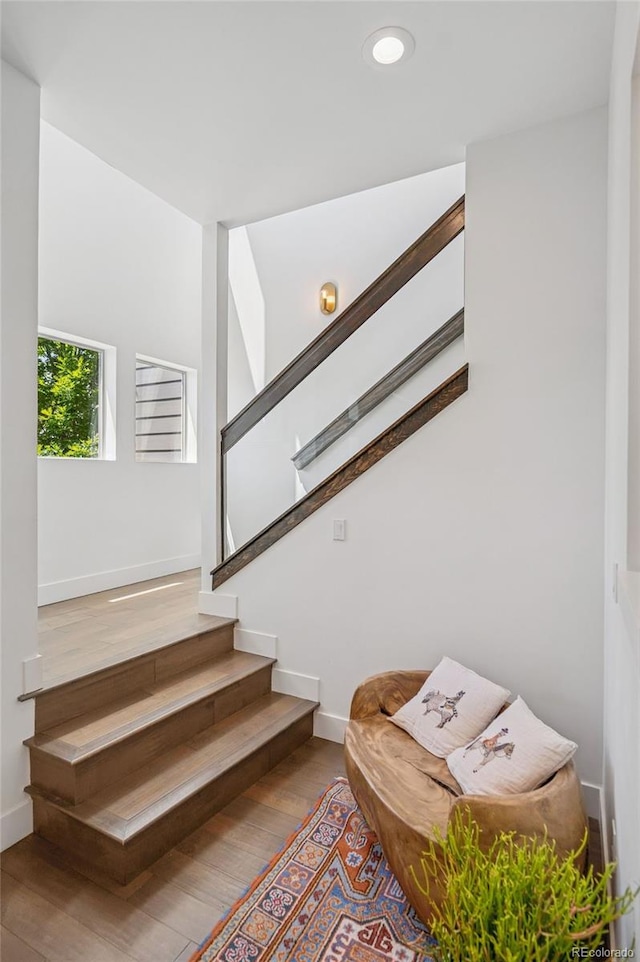 4958 Valentia Ct, Denver, CO 80238 - stairs with wood finished floors, baseboards, and recessed lighting