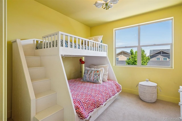 4958 Valentia Ct, Denver, CO 80238 - carpeted bedroom with multiple windows and baseboards