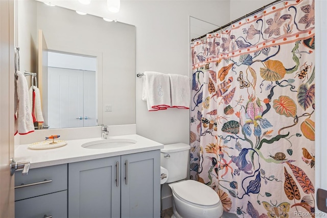 4958 Valentia Ct, Denver, CO 80238 - full bathroom featuring vanity, toilet, and a shower with curtain