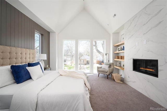 bedroom with high vaulted ceiling, a fireplace, and carpet floors